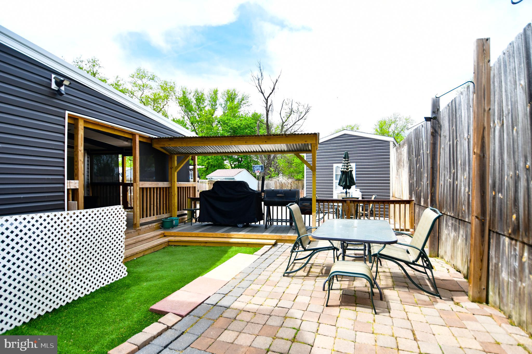 5934 Conover Road Taneytown, MD 21787 - Photo 31 of 38 a view of a patio with a table and chairs