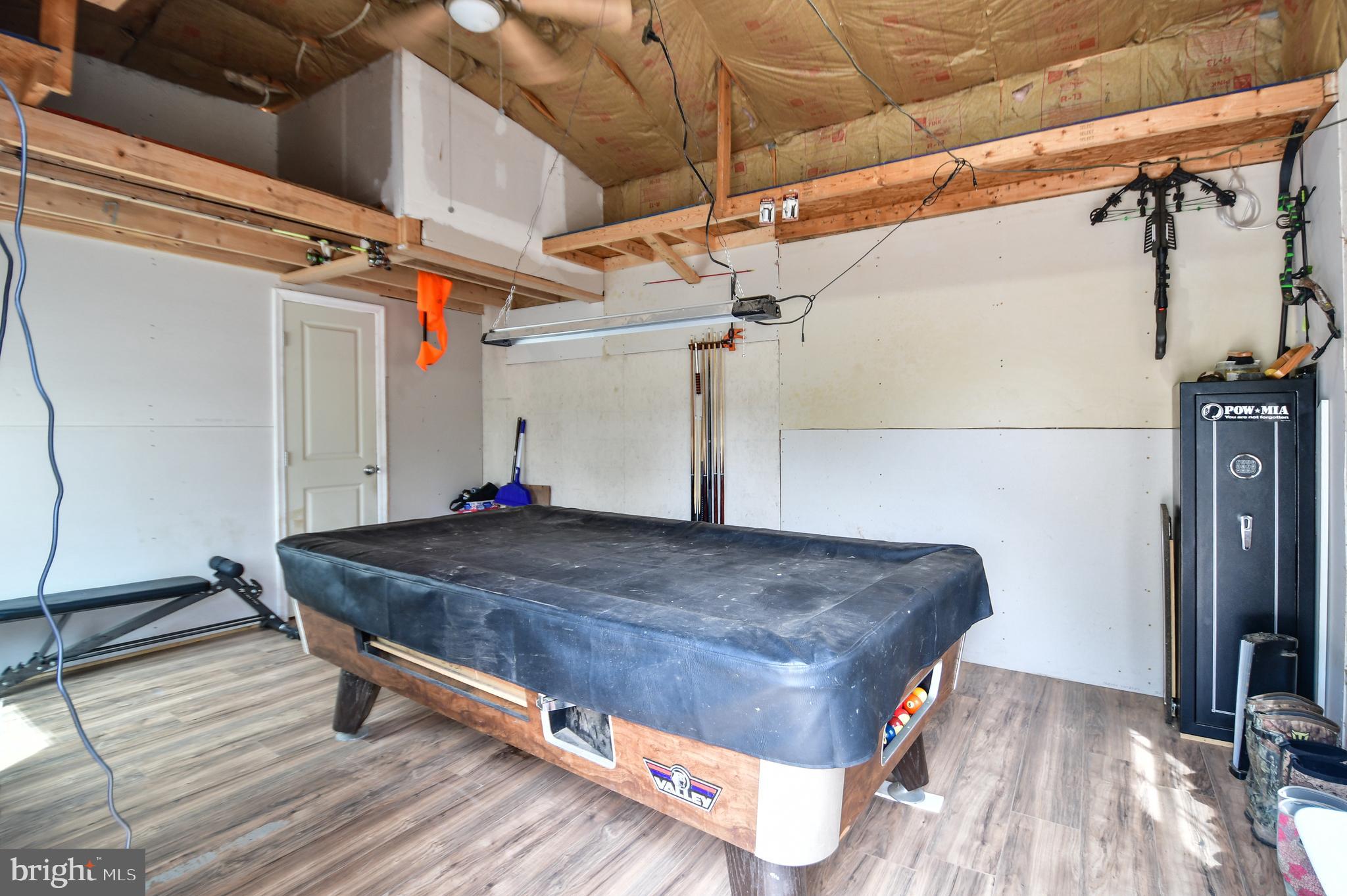 5934 Conover Road Taneytown, MD 21787 - Photo 37 of 38 a room with wooden walls and glass door