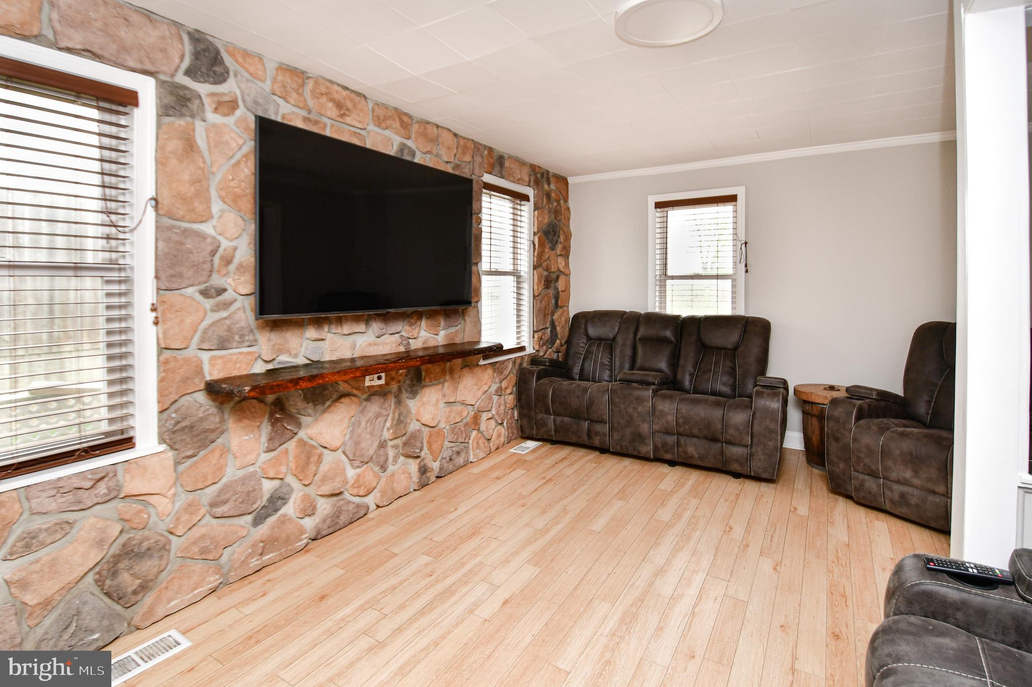 5934 Conover Road Taneytown, MD 21787 - Photo 6 of 38 a living room with furniture and a flat screen tv