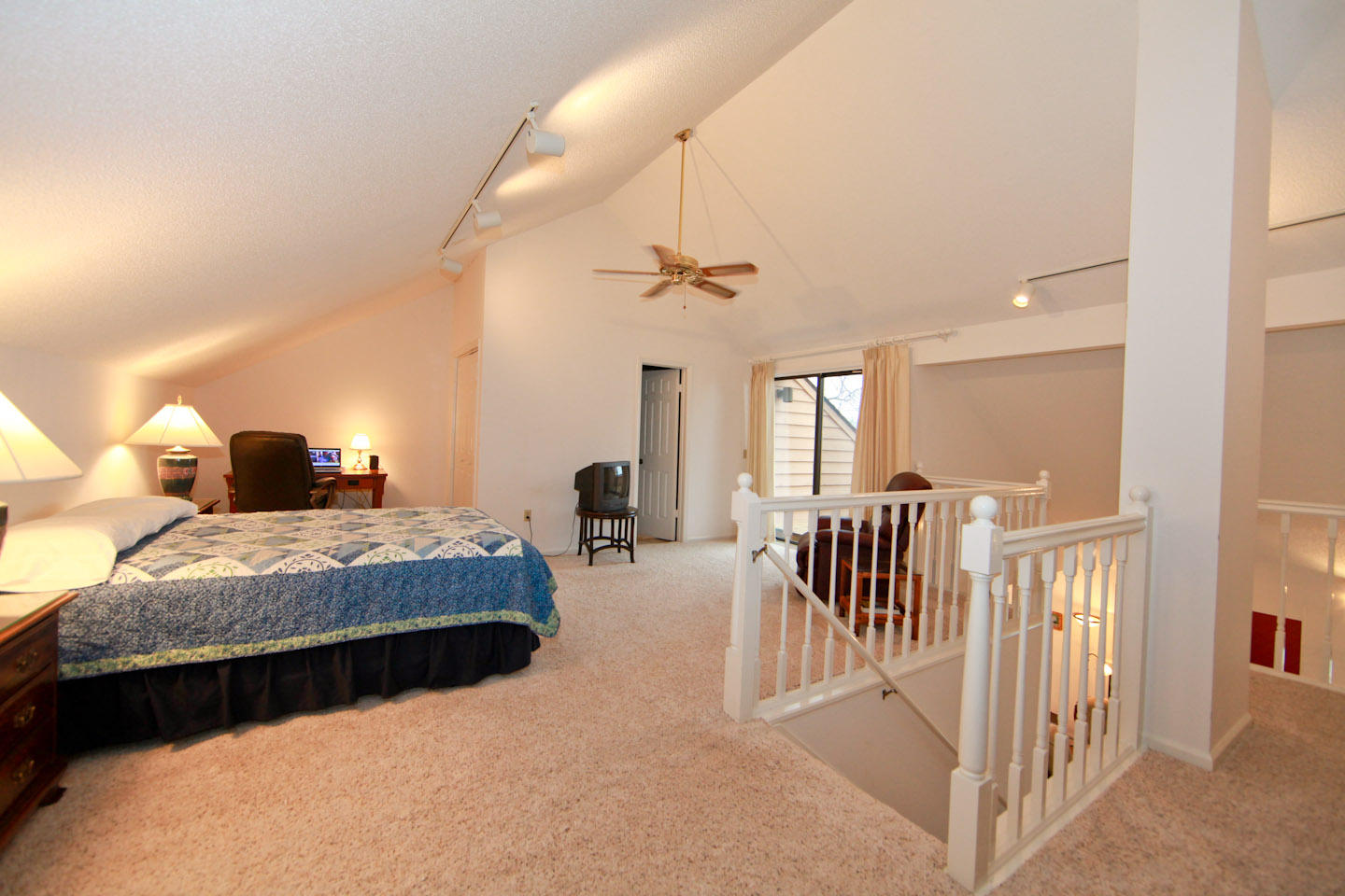 645 Monte Vista Road, Unit 103 Union Hall, VA 24176 - Photo 15 of 32 a bedroom with bed and a chandelier