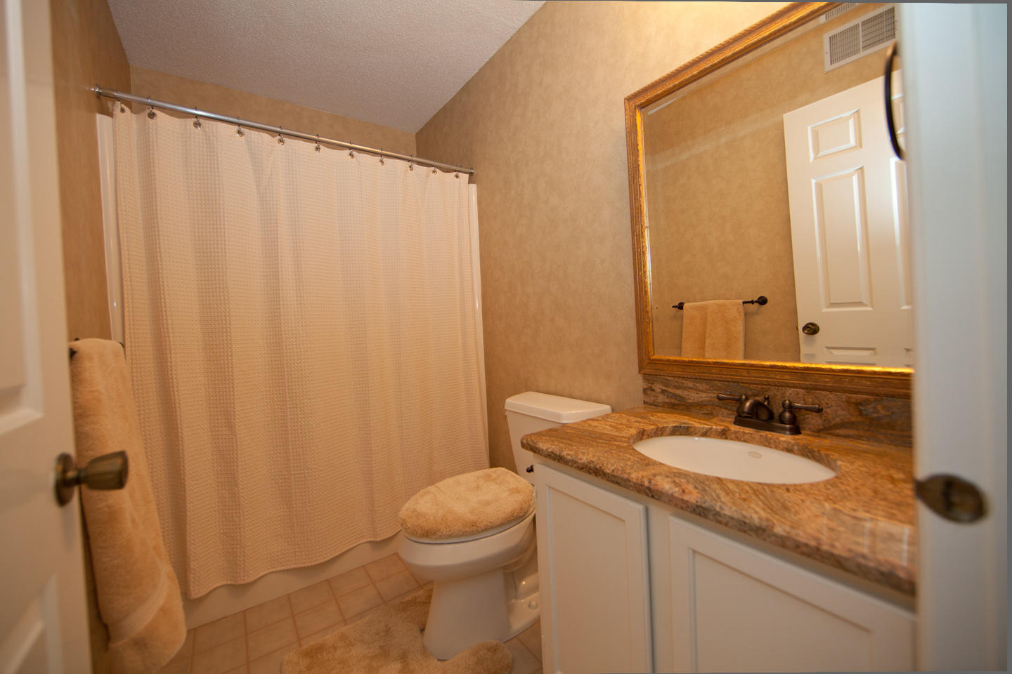 645 Monte Vista Road, Unit 103 Union Hall, VA 24176 - Photo 23 of 32 a bathroom with a granite countertop sink and a mirror