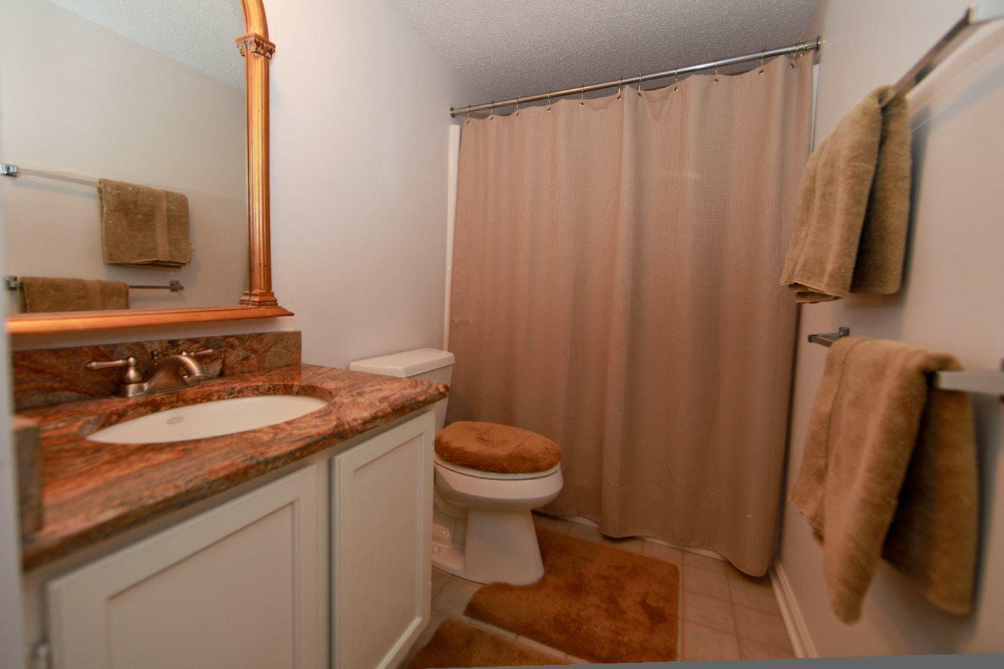 645 Monte Vista Road, Unit 103 Union Hall, VA 24176 - Photo 25 of 32 a bathroom with a granite countertop sink toilet and shower