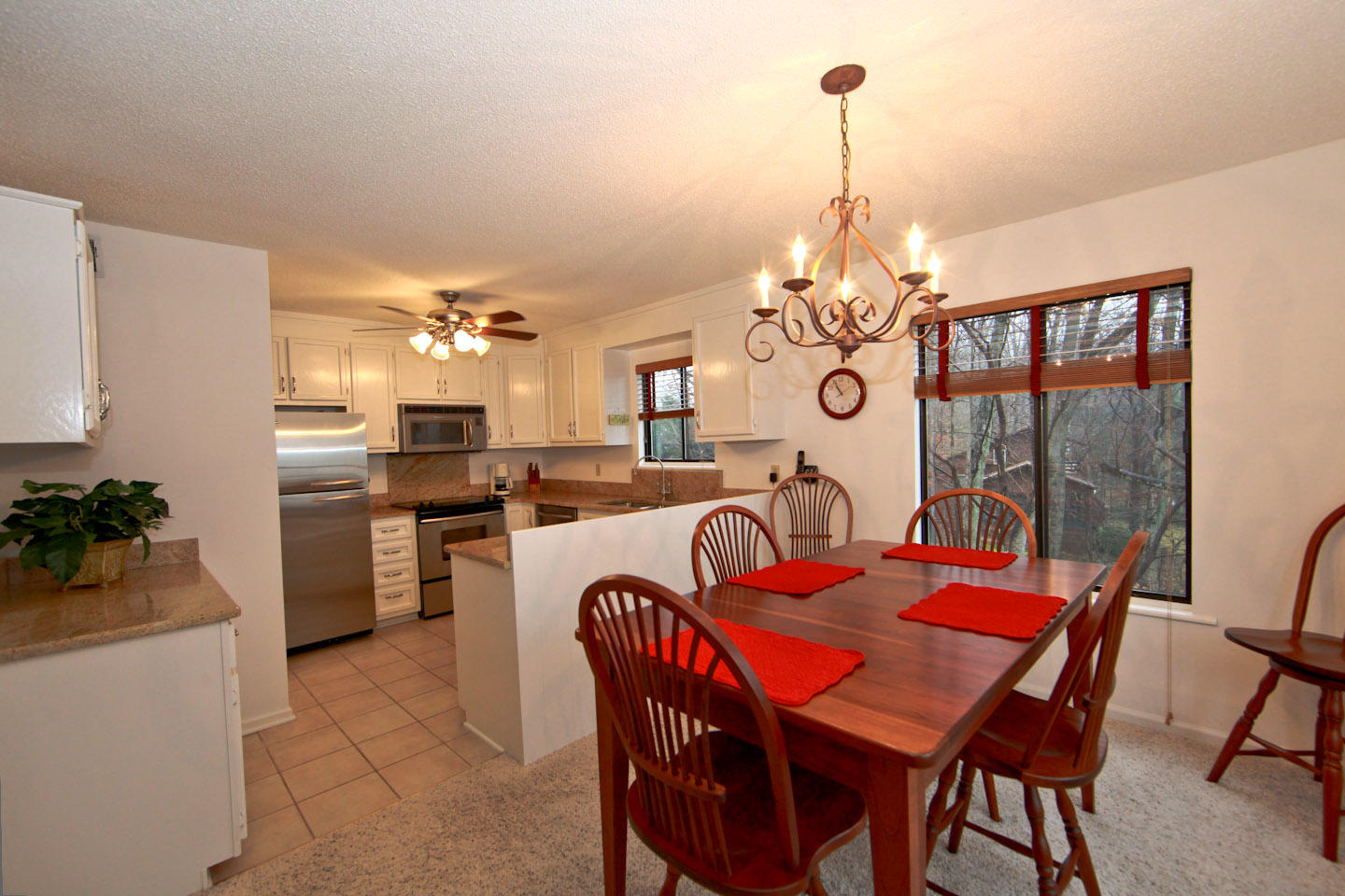 645 Monte Vista Road, Unit 103 Union Hall, VA 24176 - Photo 6 of 32 a dining room filled chandelier and wooden floor