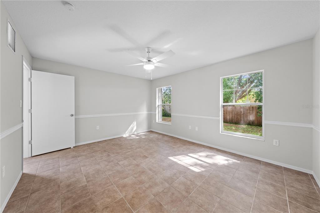 750 West New Nolte Road St. Cloud, FL 34769 - Photo 28 of 59 an empty room with windows and fan
