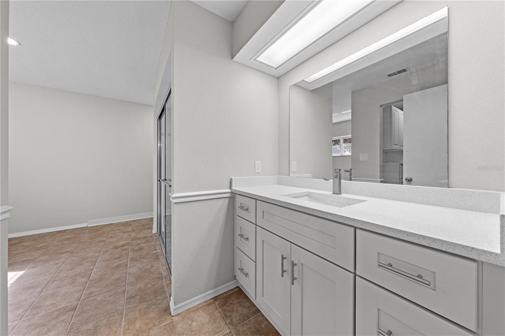 750 West New Nolte Road St. Cloud, FL 34769 - Photo 29 of 59 a bathroom with a sink and a mirror