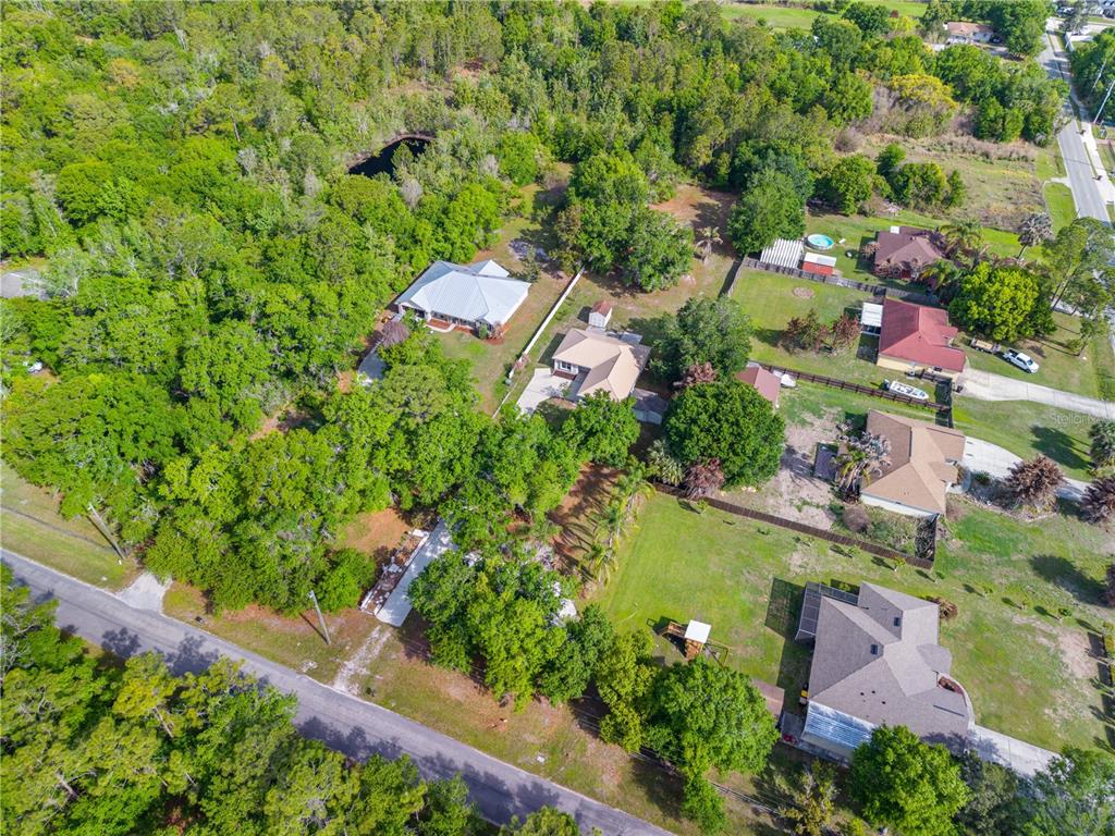 750 West New Nolte Road St. Cloud, FL 34769 - Photo 47 of 59 an aerial view of a house with a garden