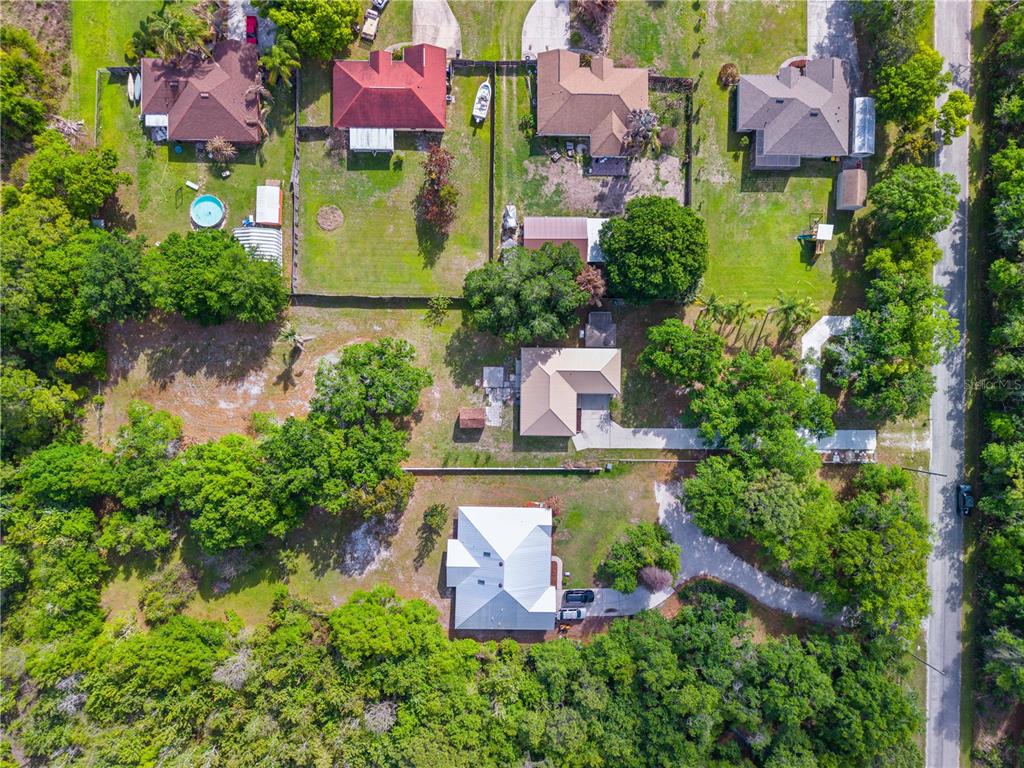 750 West New Nolte Road St. Cloud, FL 34769 - Photo 48 of 59 an aerial view of residential house with outdoor space and swimming pool