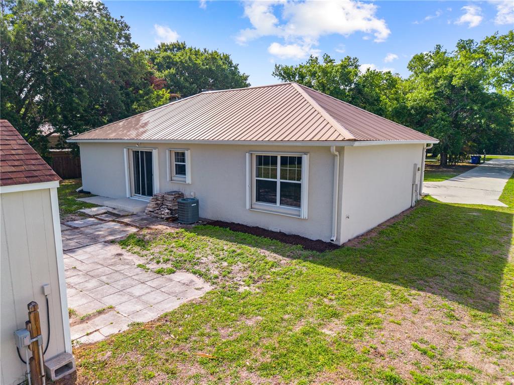 750 West New Nolte Road St. Cloud, FL 34769 - Photo 55 of 59 a view of a house with backyard and garden