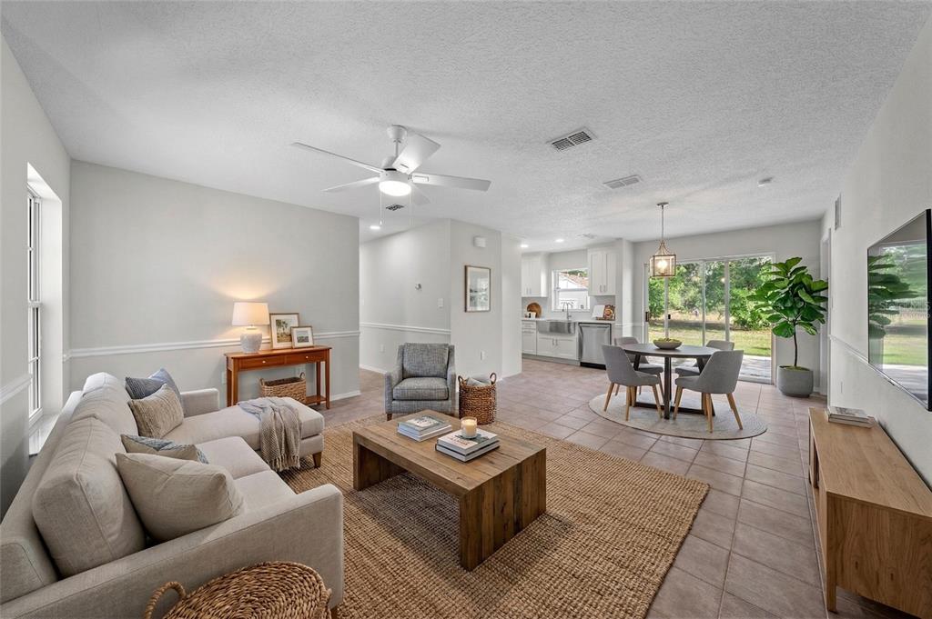 750 West New Nolte Road St. Cloud, FL 34769 - Photo 10 of 59 a living room with furniture and a large window