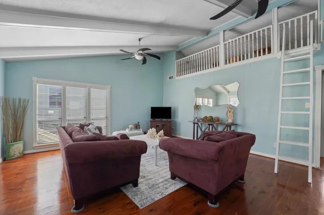 a kitchen with stainless steel appliances kitchen island granite countertop a dining table chairs and granite counter tops