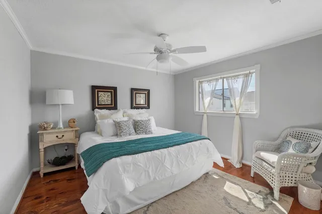 a bedroom with furniture and window