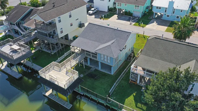 a view of a backyard with a patio and deck
