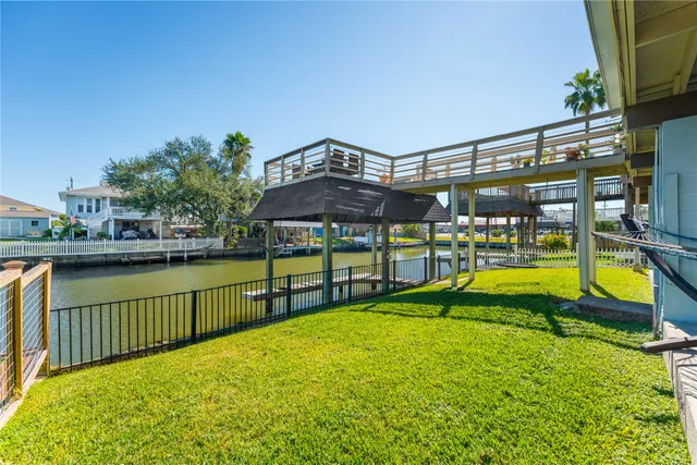a view of a house with a yard patio and fire pit