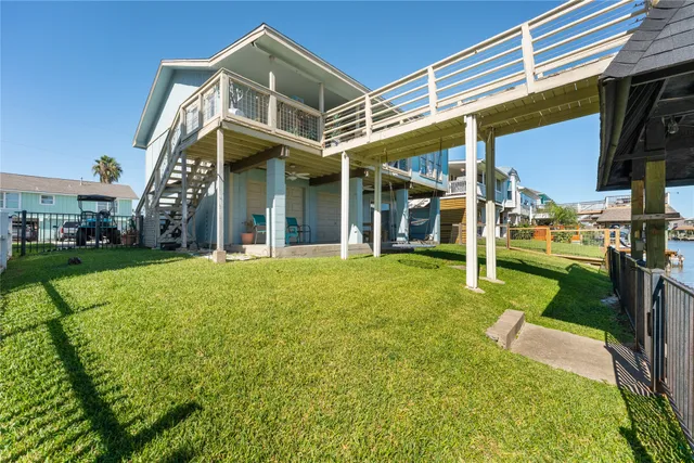 an aerial view of a house with a lake view