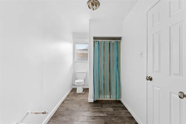 a view of a bathroom from the hallway