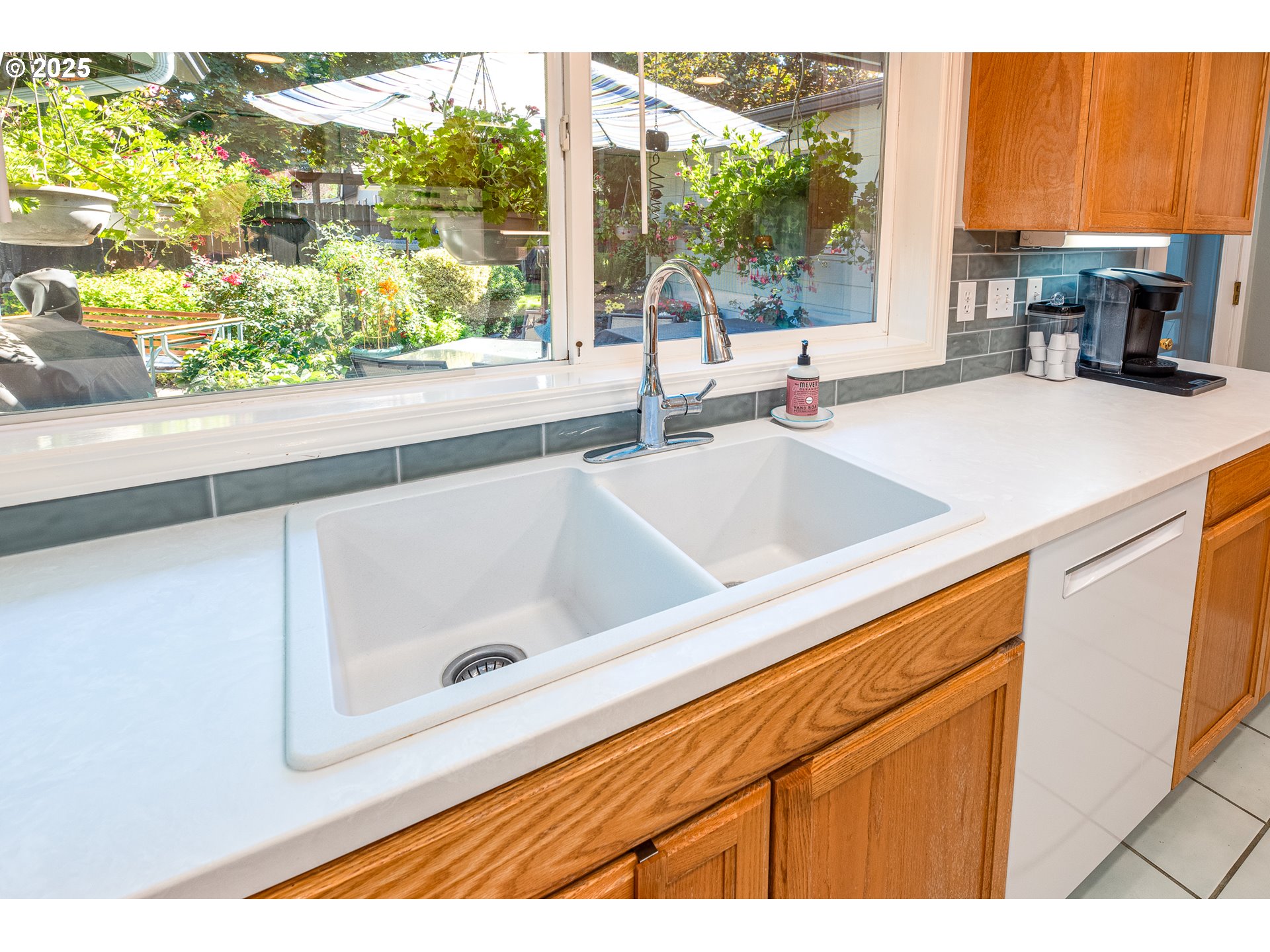 633 Rowan Avenue Springfield, OR 97477 - Photo 12 of 47 a bathroom with a sink and a large window