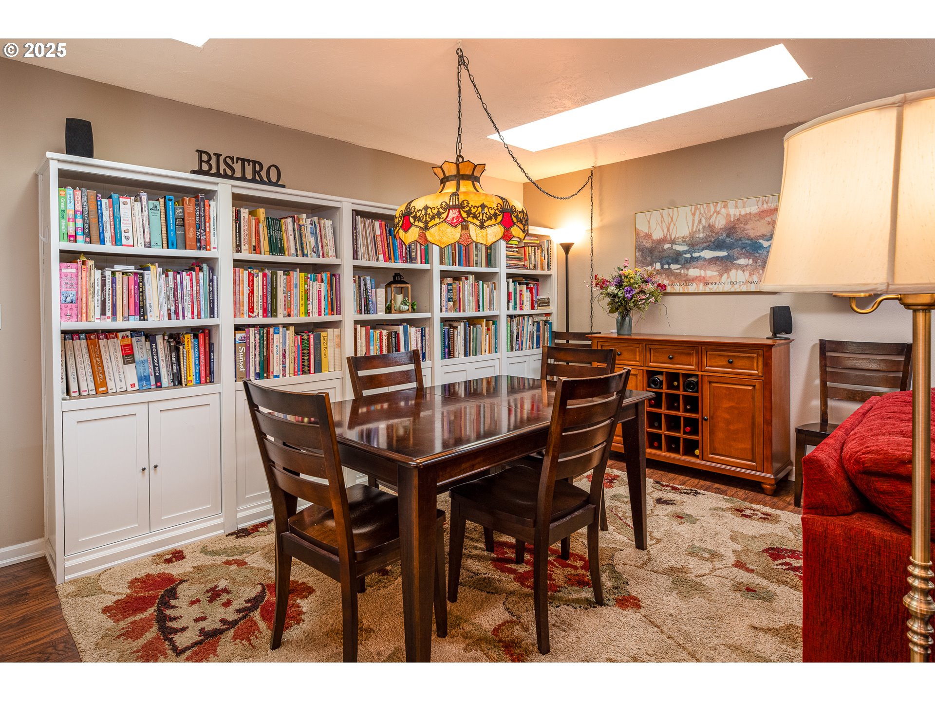 633 Rowan Avenue Springfield, OR 97477 - Photo 18 of 47 a view of a dining room with furniture and a book shelf