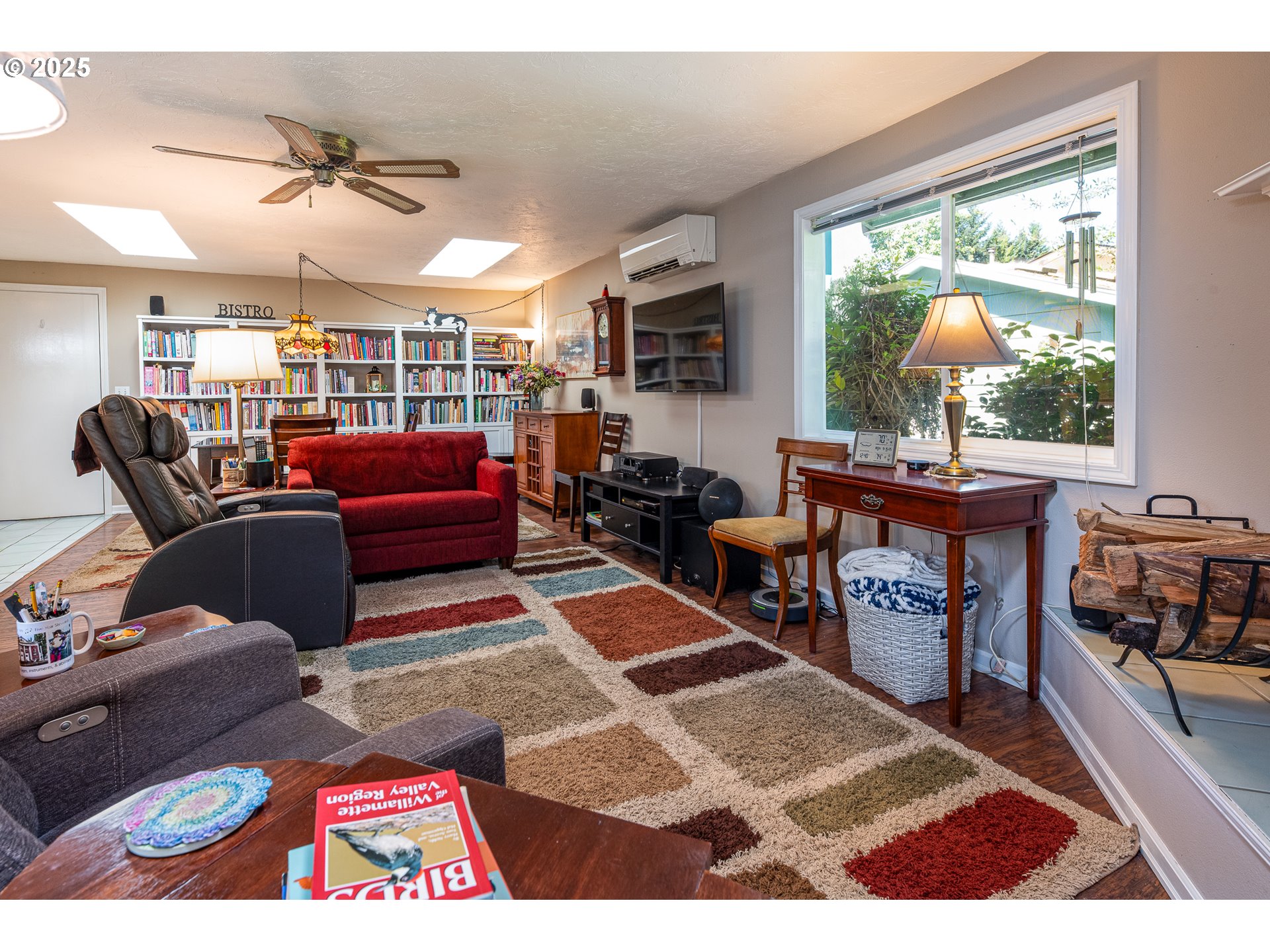 633 Rowan Avenue Springfield, OR 97477 - Photo 20 of 47 a living room with furniture a rug and a floor to ceiling window