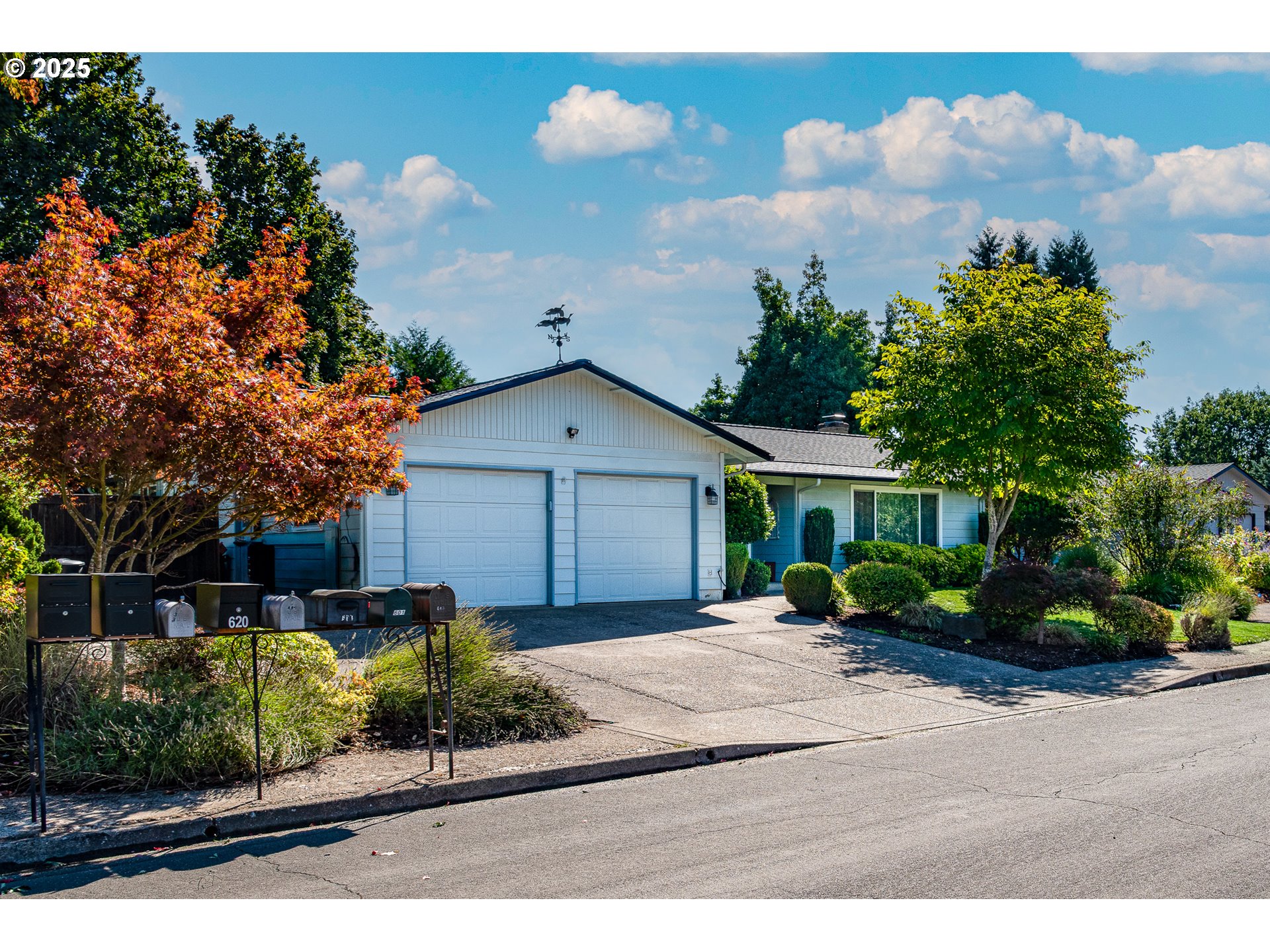 633 Rowan Avenue Springfield, OR 97477 - Photo 34 of 47 a front view of a house with a yard and potted plants
