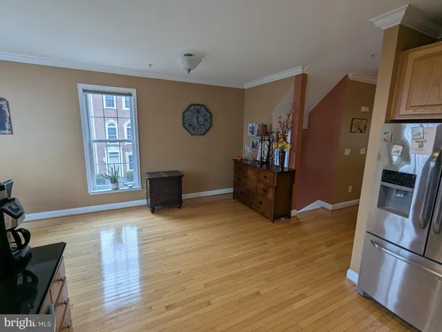 a view of kitchen with furniture and wooden floor