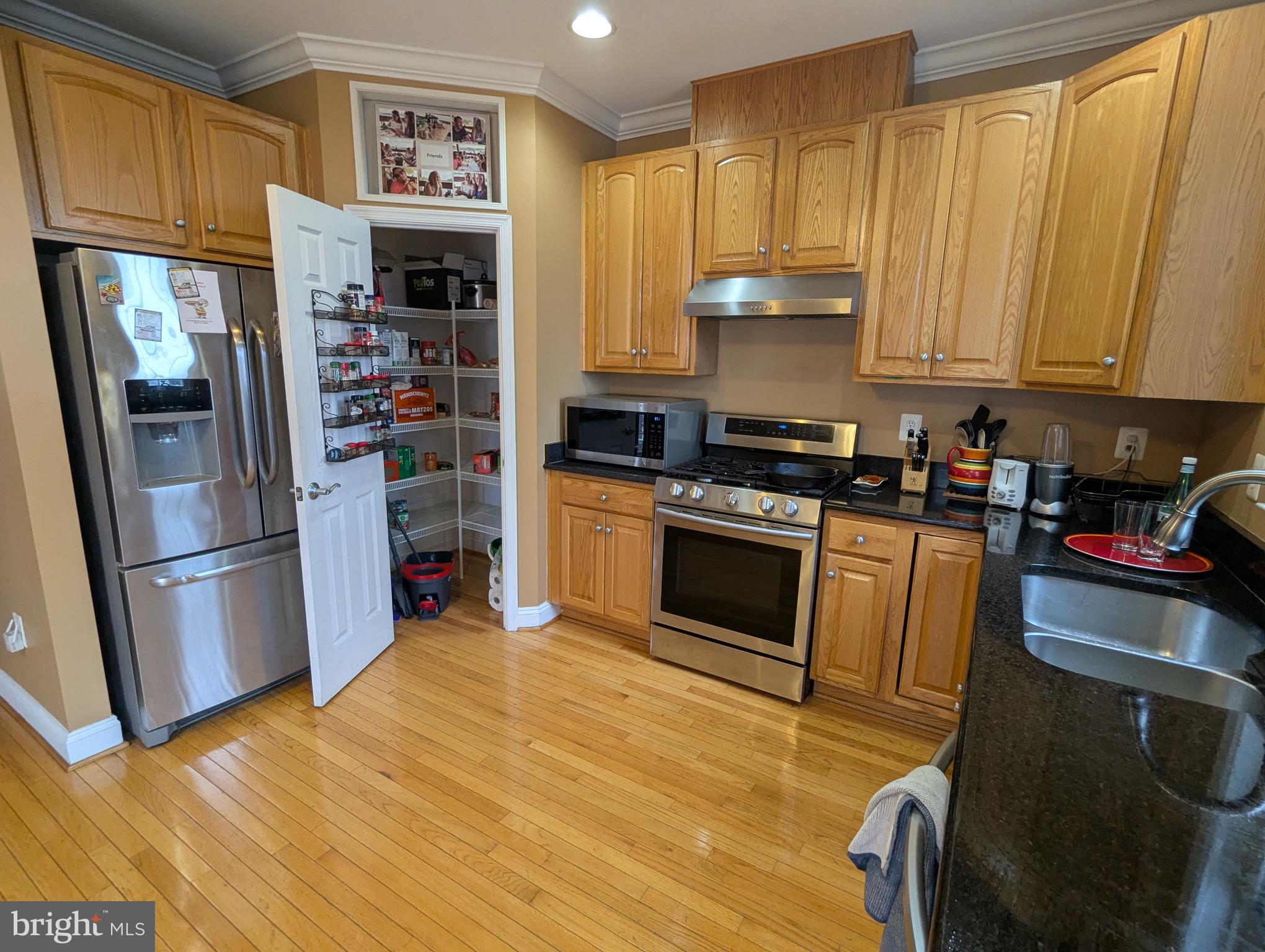 810 Ramsay Street Baltimore, MD 21230 - Photo 22 of 61 a kitchen with stainless steel appliances granite countertop a refrigerator stove and sink