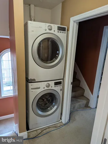 a bed sitting in a bedroom next to a lamp