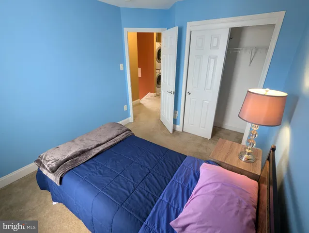 a bed room with a bed and a television