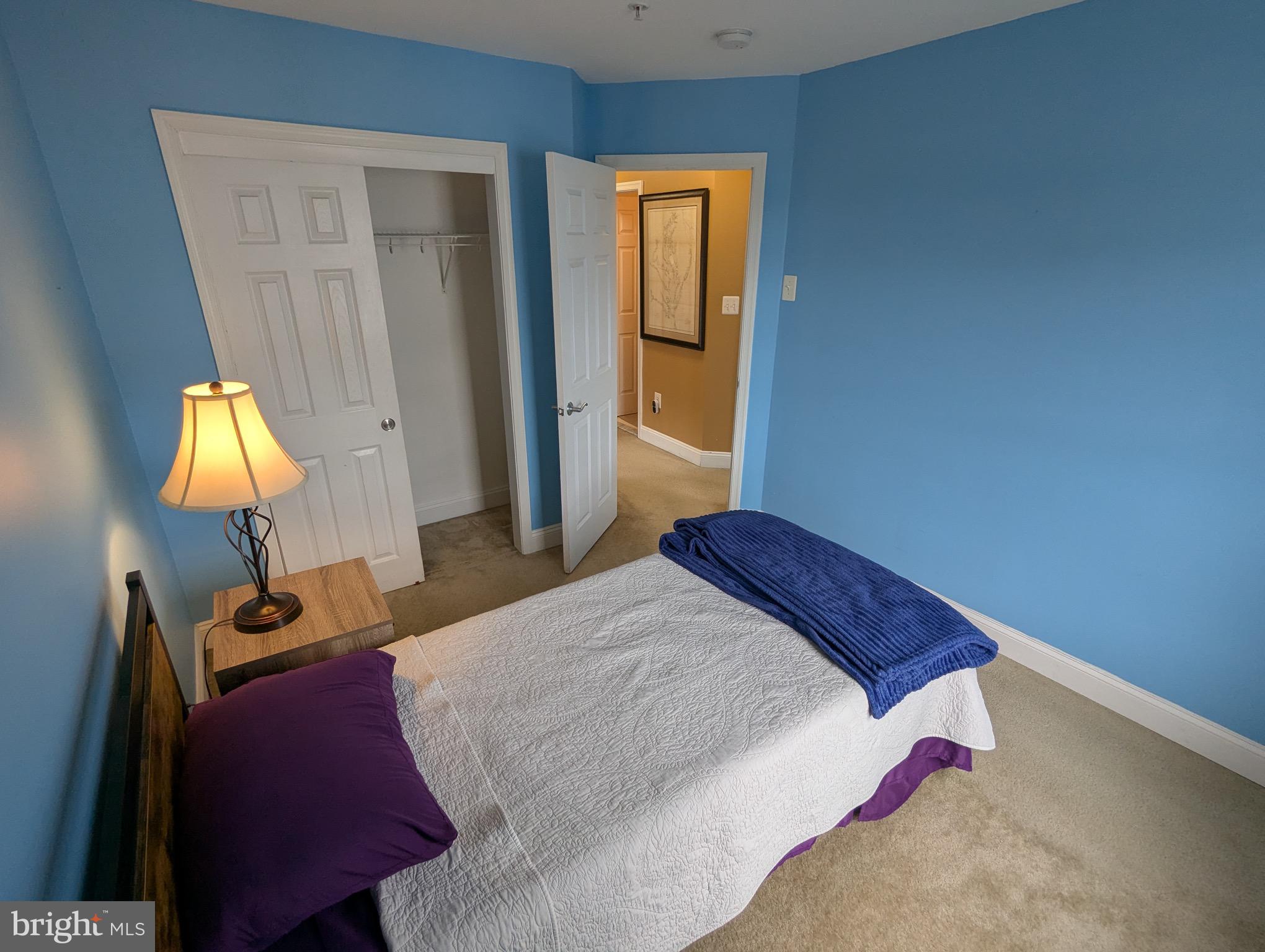 810 Ramsay Street Baltimore, MD 21230 - Photo 40 of 61 a bedroom with a bed and a lamp