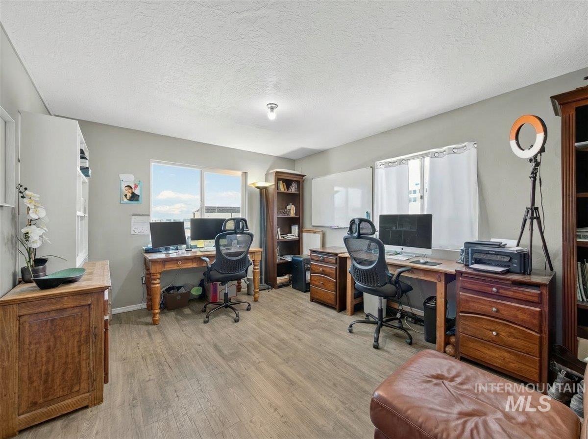 2588 West Sales Yard Road Emmett, ID 83617 - Photo 26 of 49 Office area featuring a textured ceiling and light wood-type flooring