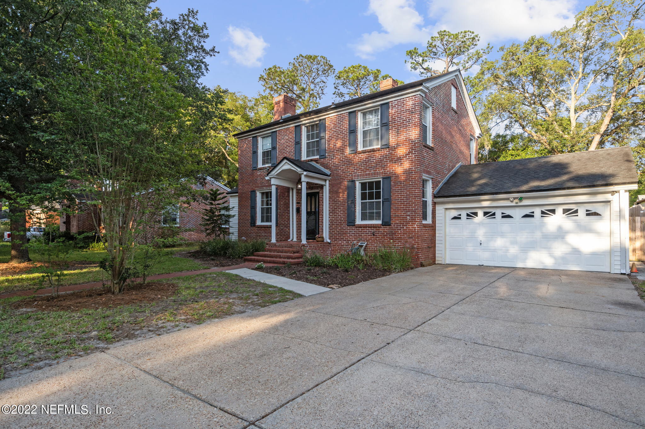 1408 Nicholson Road Jacksonville, FL 32207 - Photo 3 of 25 front view of house with a yard
