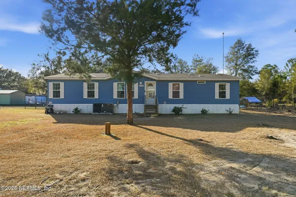 a house view with a backyard space