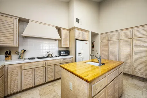a kitchen with a sink and cabinets