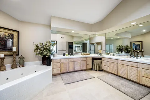 a large white tub sitting in a bathroom