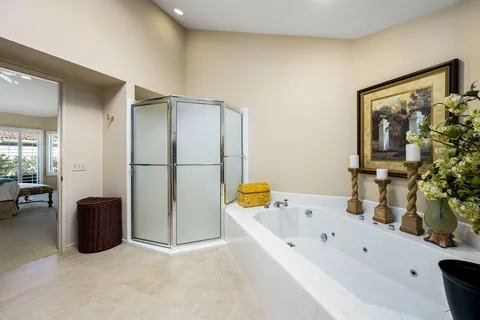 a bathroom with a tub and a sink