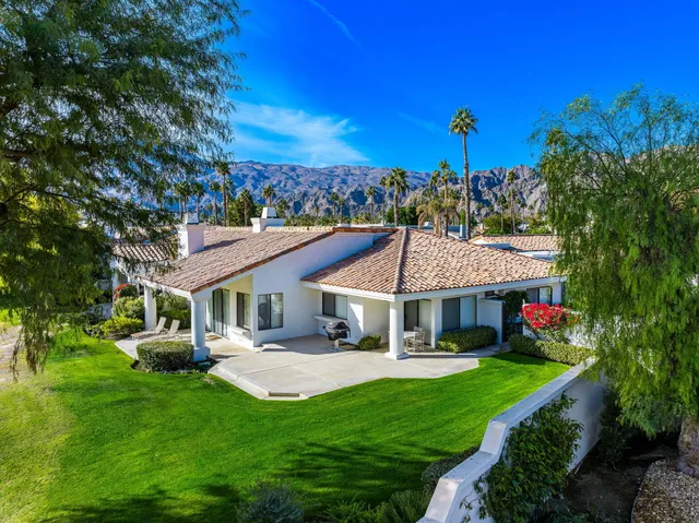 a view of house with a garden