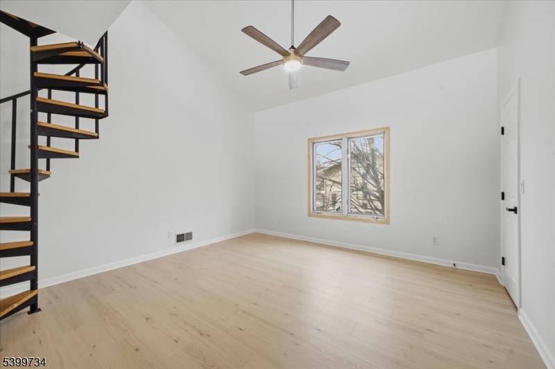 103 Cheyenne Road Lafayette, NJ 07848 - Photo 17 of 27 an empty room with windows and fan
