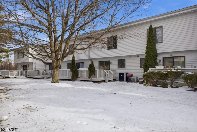 103 Cheyenne Road Lafayette, NJ 07848 - Photo 26 of 27 a view of a house with a large tree in front of it
