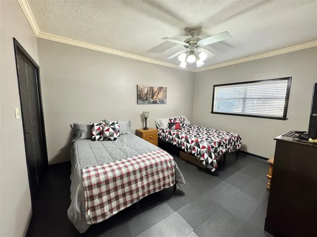 a bedroom with bed and a window