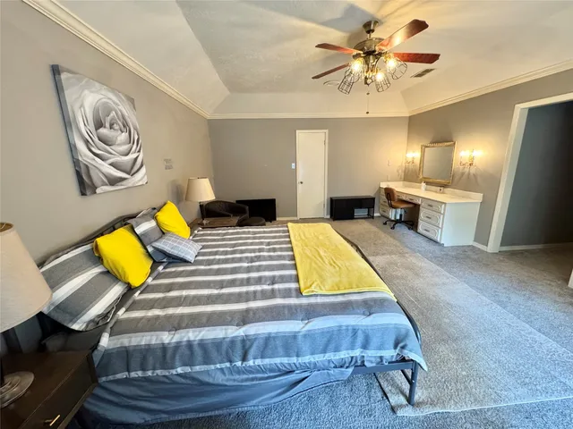 a room with pool table and paintings on the wall