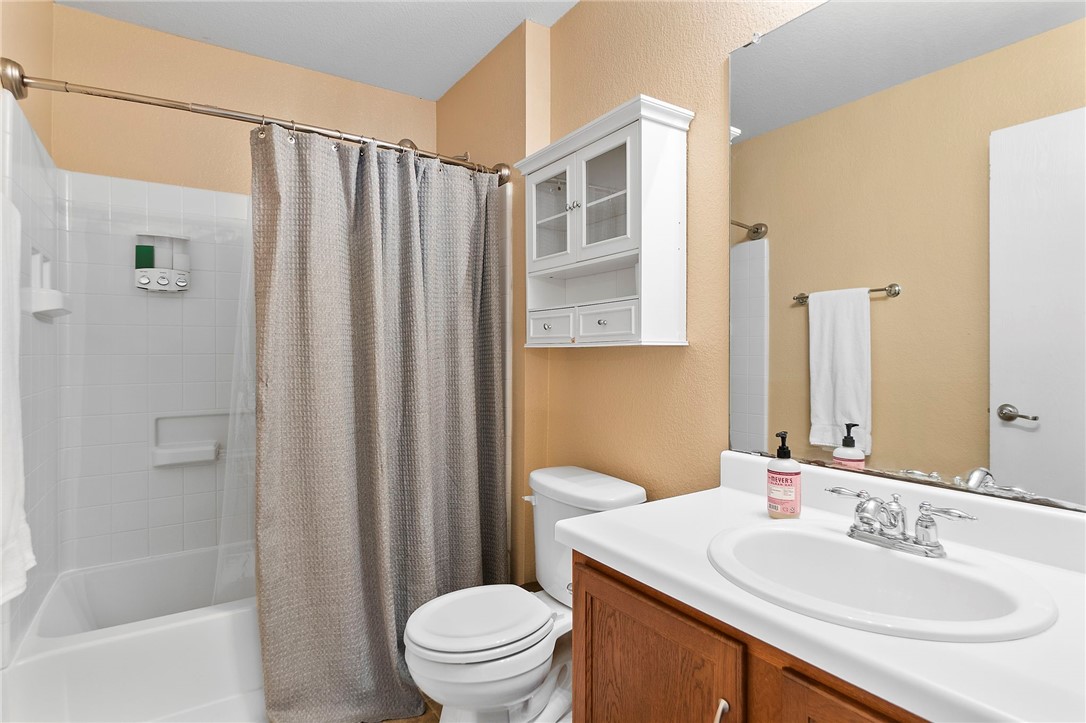 5908 Silver Screen Drive Austin, TX 78747 - Photo 20 of 24 a bathroom with a sink toilet and shower