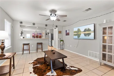 a living room with furniture and a table