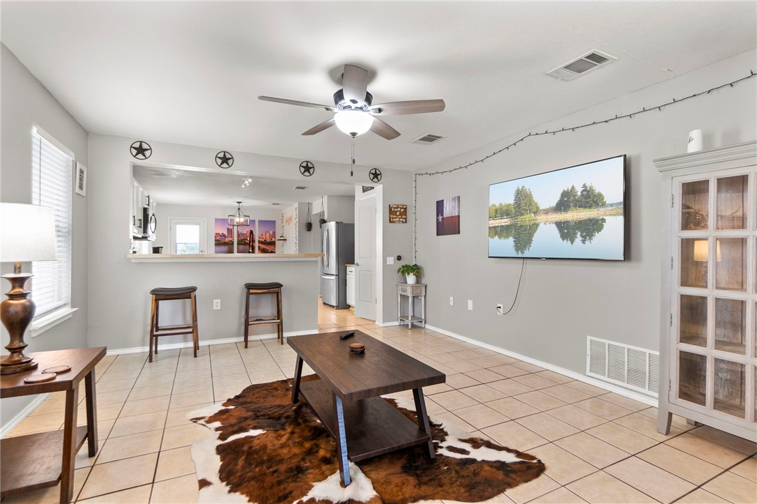 5908 Silver Screen Drive Austin, TX 78747 - Photo 2 of 24 a living room with furniture and a table