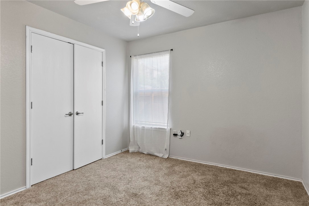 5908 Silver Screen Drive Austin, TX 78747 - Photo 21 of 24 an empty room with chandelier fan