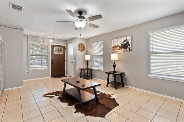 a living room with furniture and window
