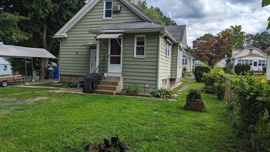 28 Bushwick Place Springfield, MA 01109 - Photo 20 of 24 a front view of a house with a garden