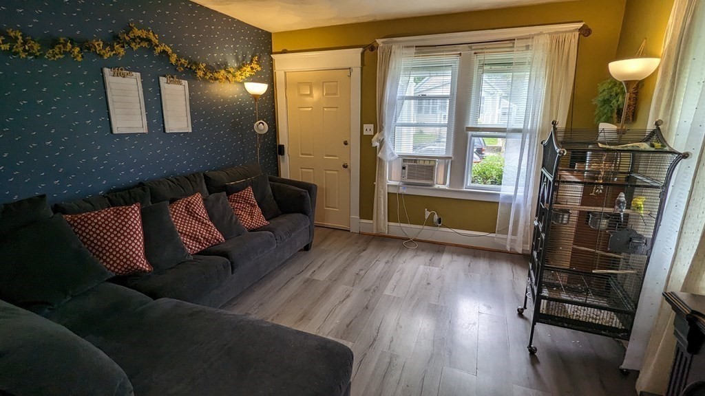 28 Bushwick Place Springfield, MA 01109 - Photo 3 of 24 a living room with furniture and a window