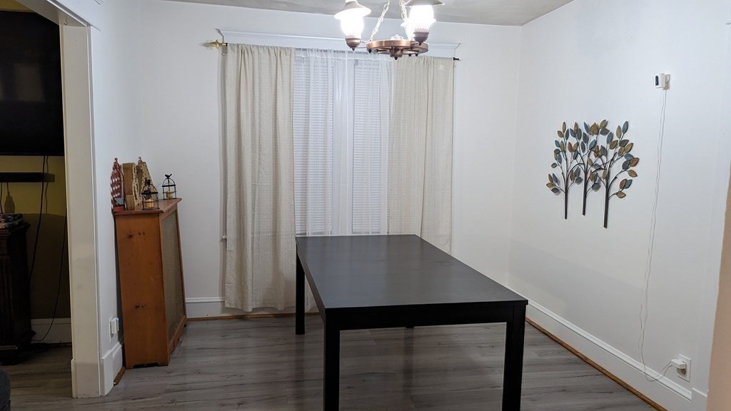 28 Bushwick Place Springfield, MA 01109 - Photo 4 of 24 a view of a room with window and wooden floor
