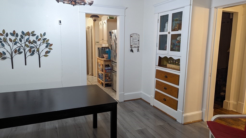 28 Bushwick Place Springfield, MA 01109 - Photo 5 of 24 a view of a hallway with wooden floor and workspace