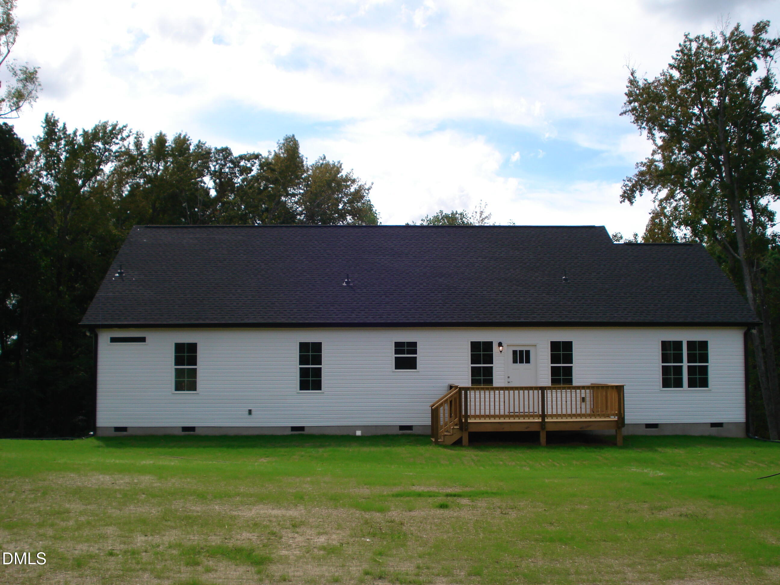 93 Big J Street Erwin, NC 28339 - Photo 16 of 56 a front view of a house with garden