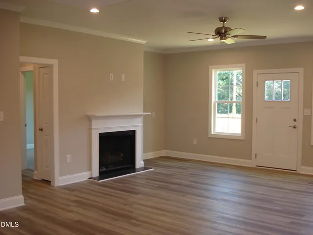 a kitchen with stainless steel appliances granite countertop a sink a stove and a microwave